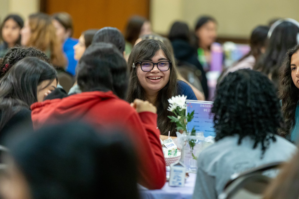 Students talking at a table