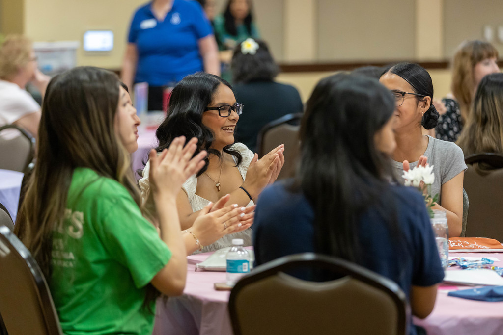 Students talking at a table