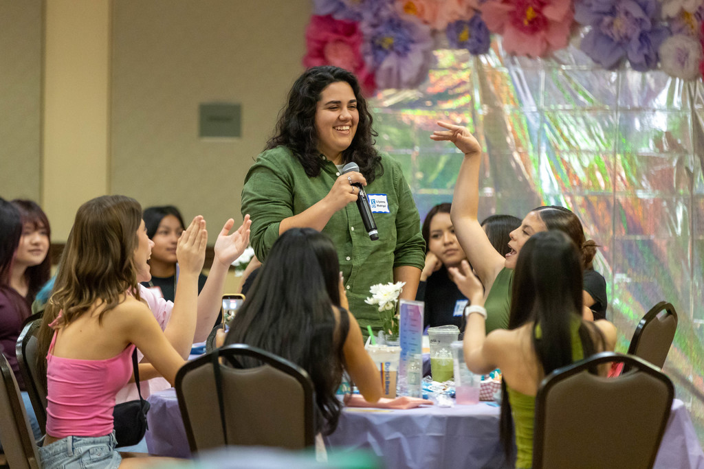 Student talking to a crowd