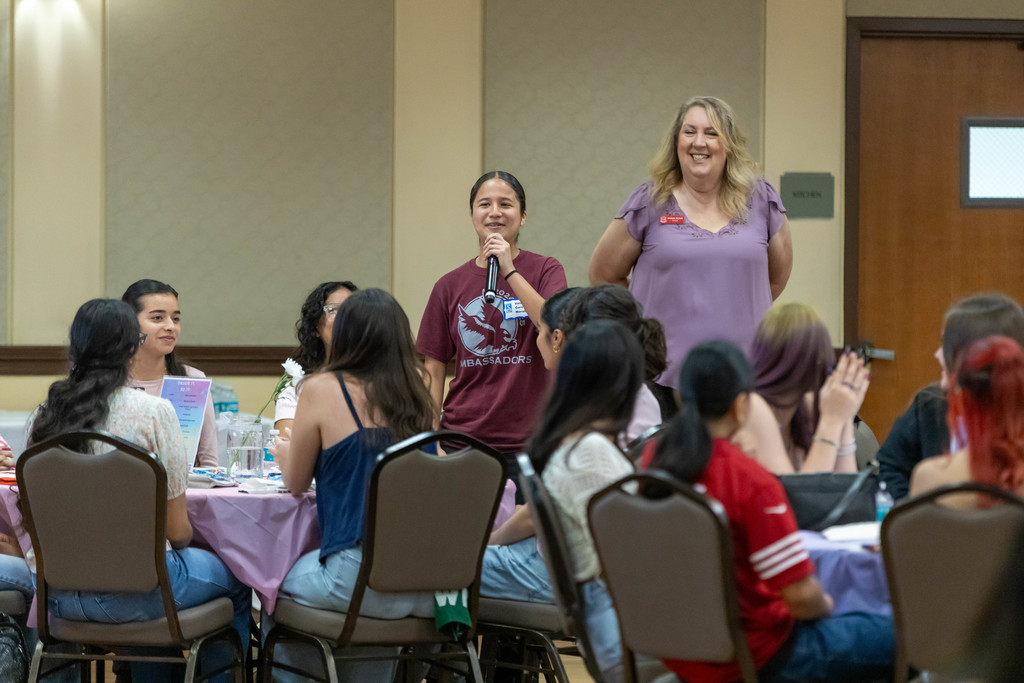 Student talking to a crowd