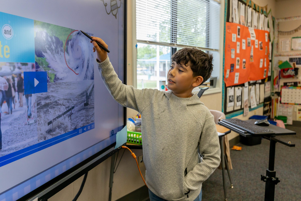 Student using a large computer