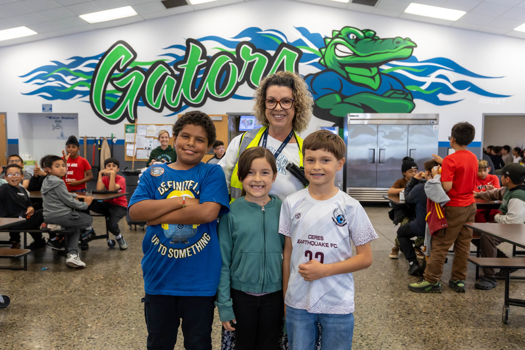 staff and students smiling for the camera