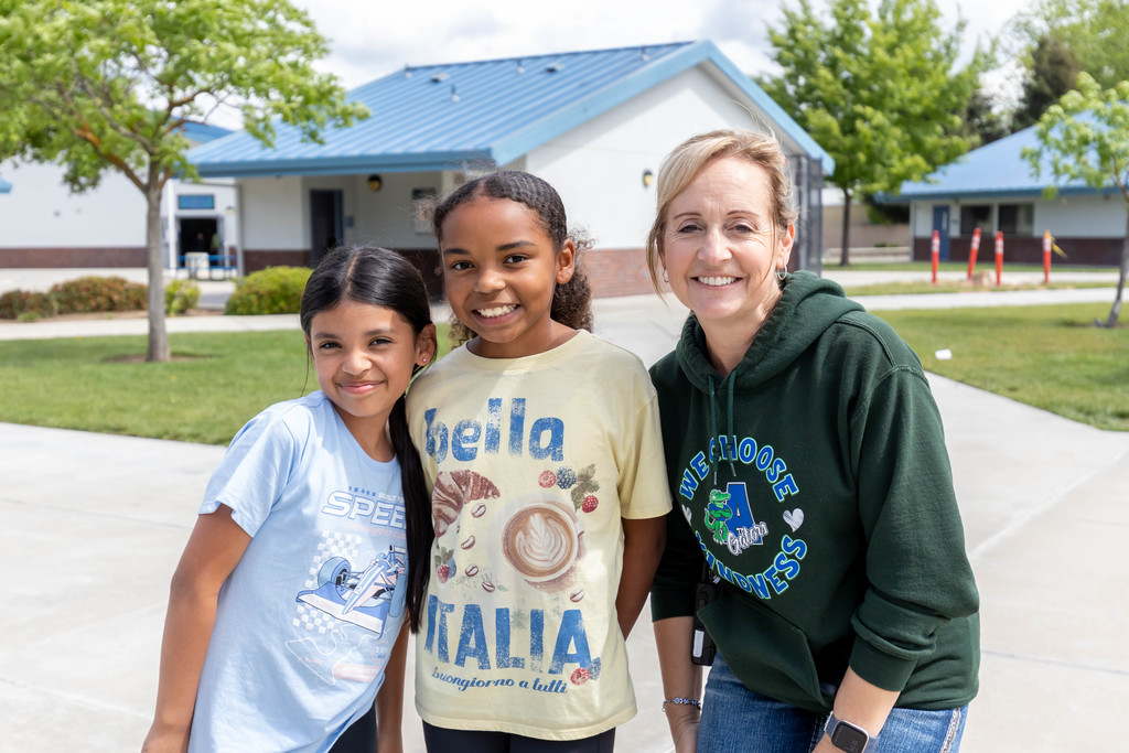 Staff and students smiling for the camera