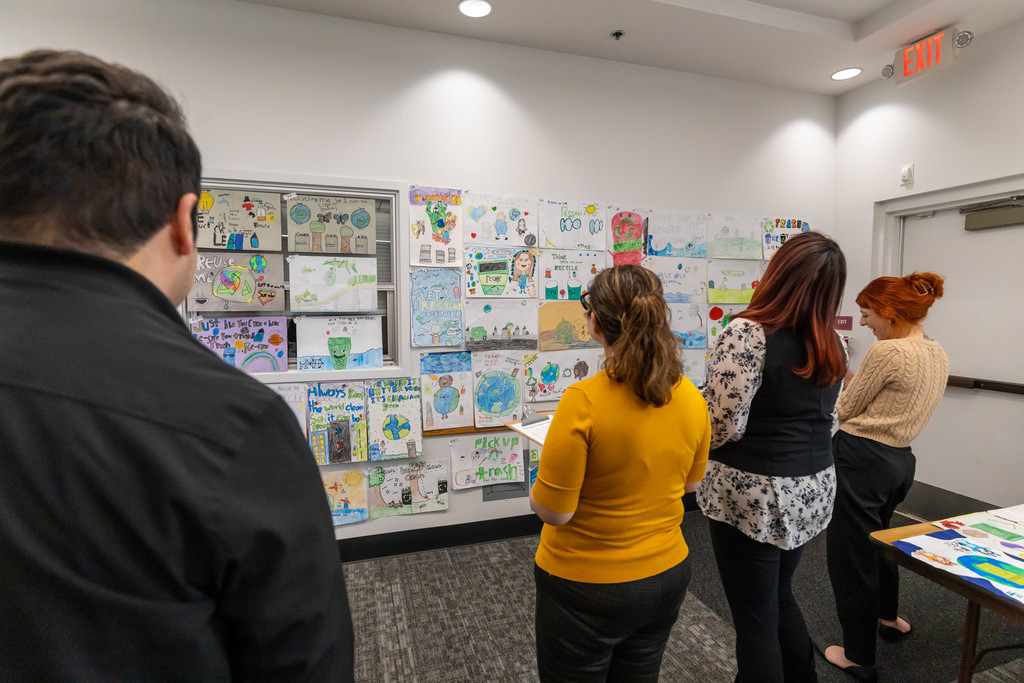 Small group of people looking at art