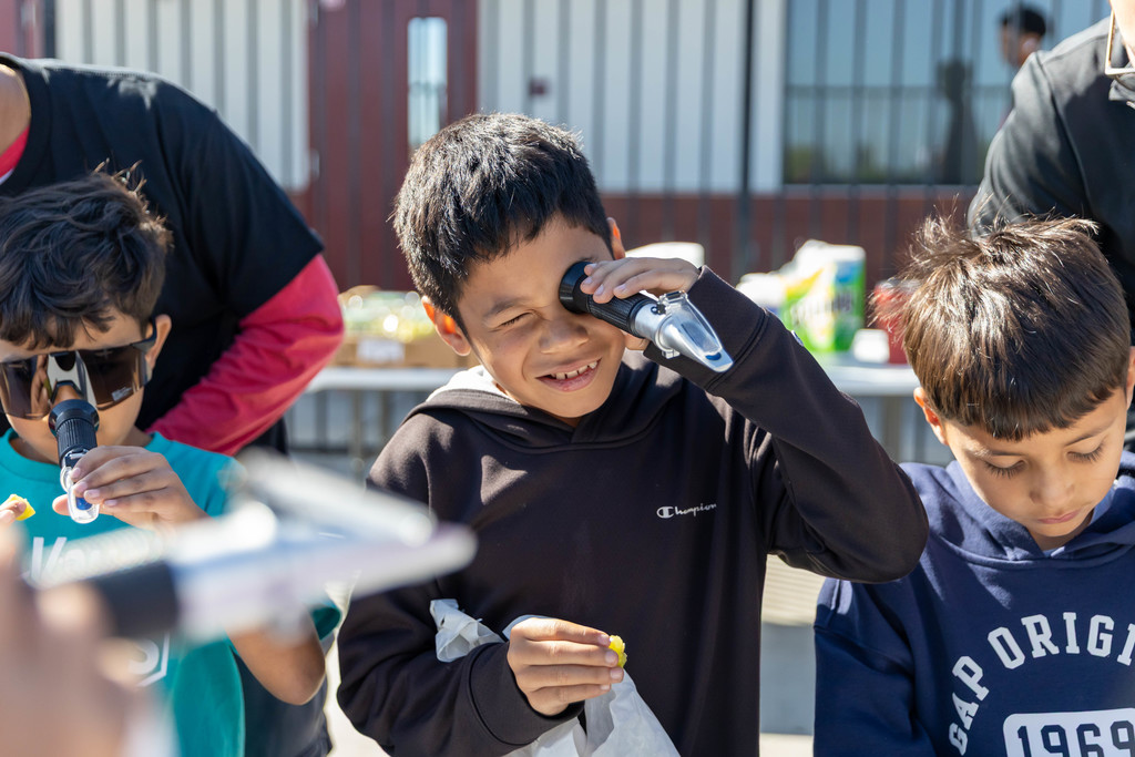 student looking through a telescope