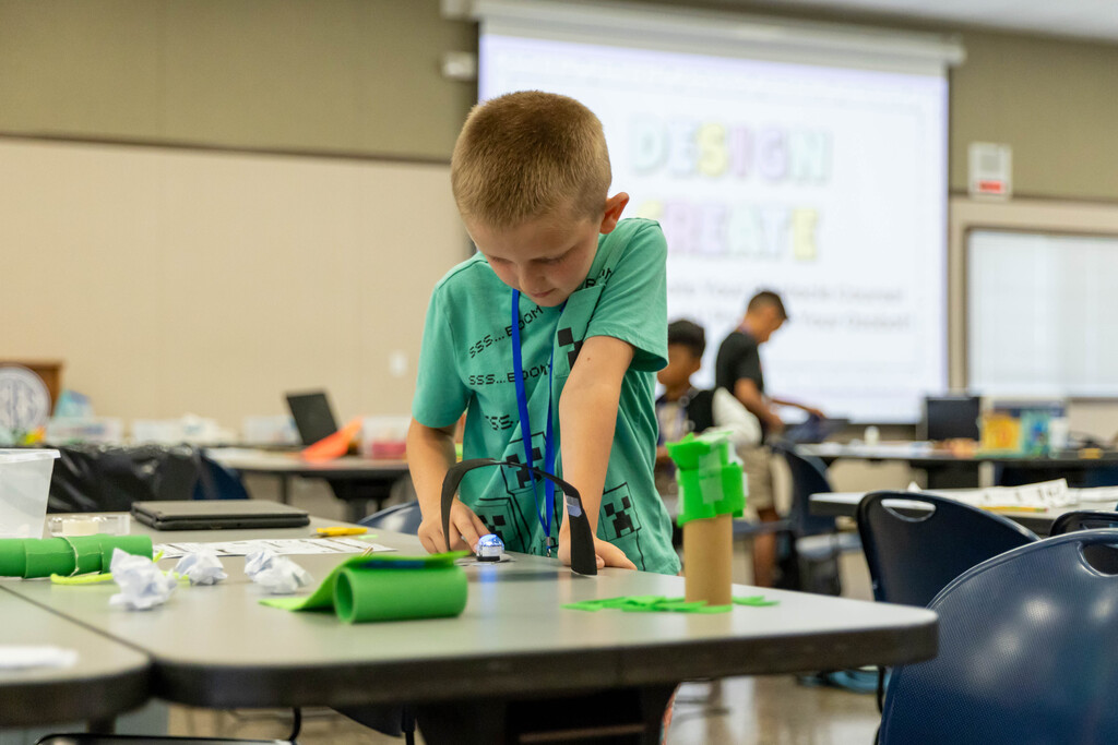student working with a robot