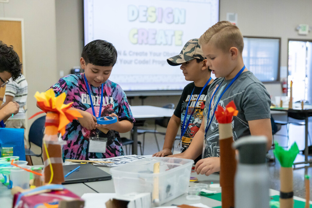 three student working on a project