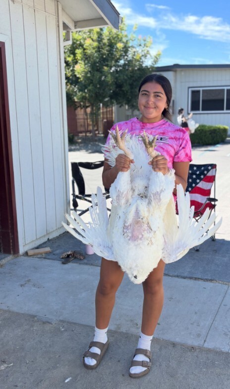student holding turkey
