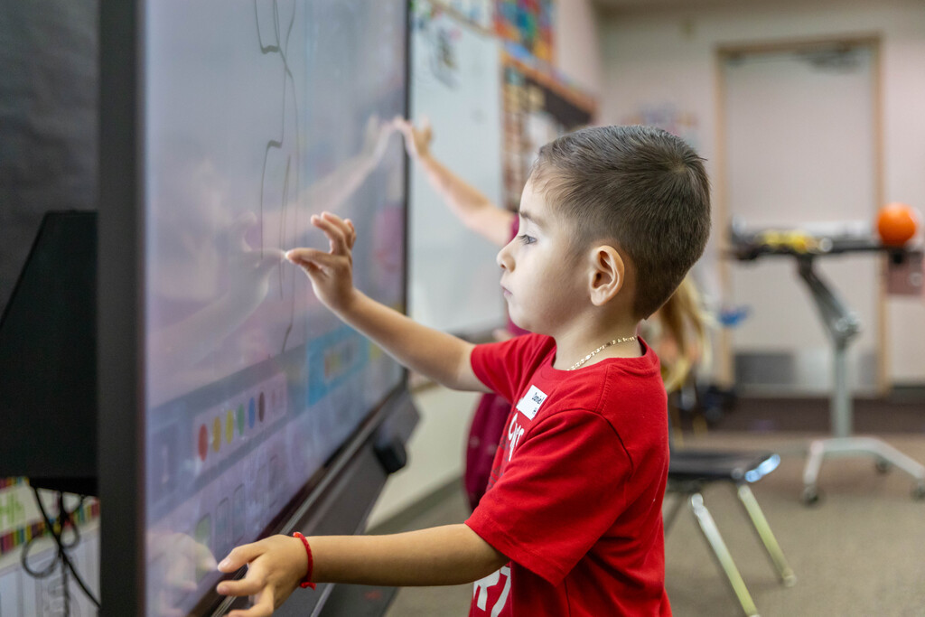 Student uses interactive screen