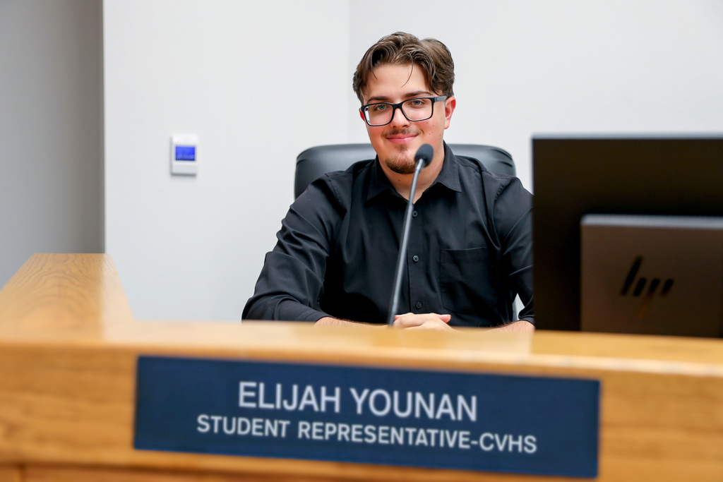 Student Representative Younan seated at Board dais