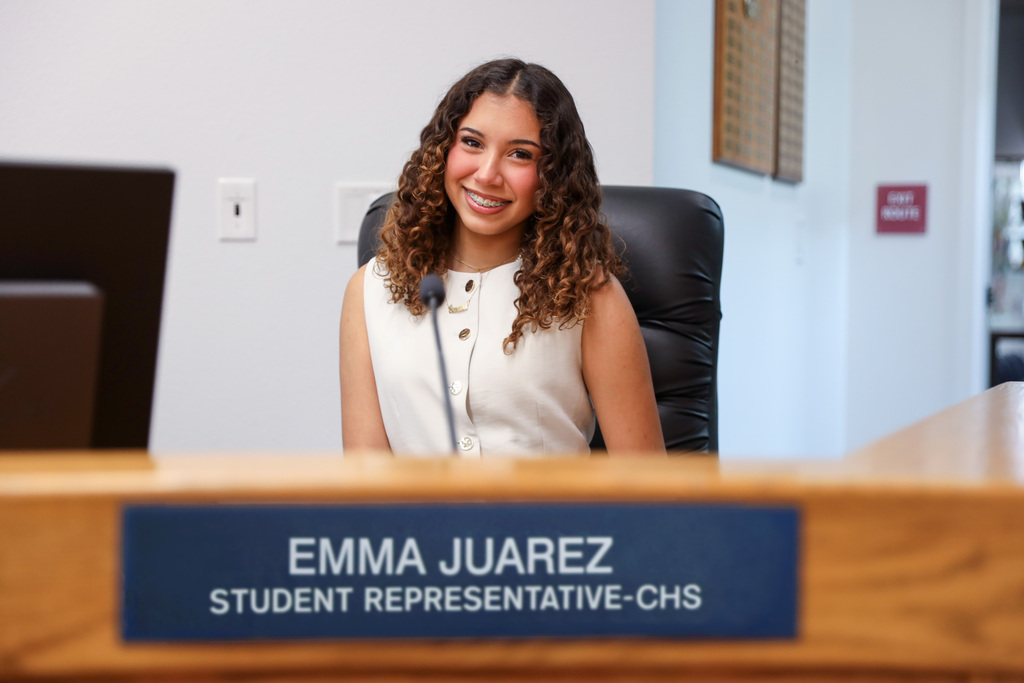 Student Representative Juarez seated at Board dais