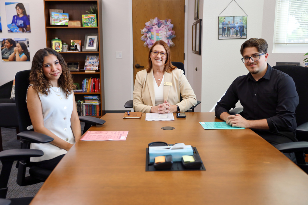 Superintendent and Student Representatives seated at conference table