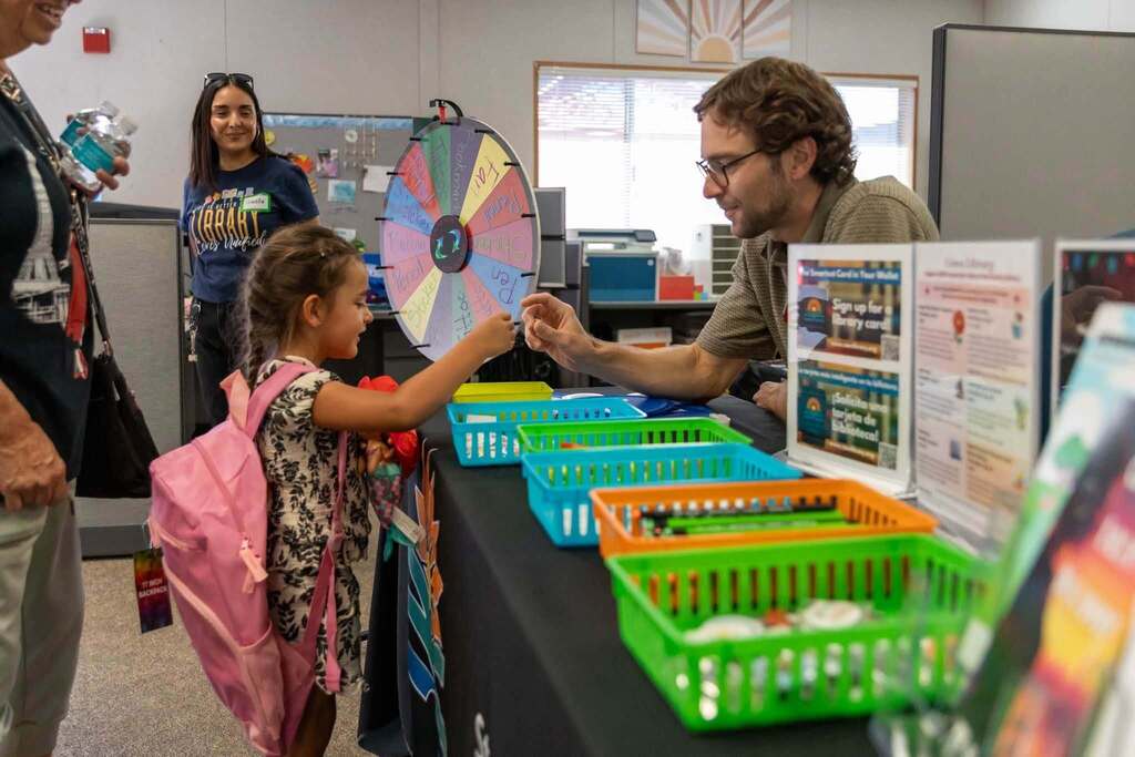 Staff member and student interact