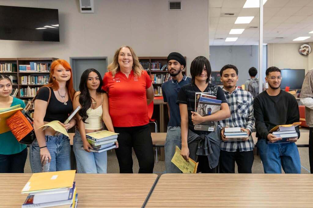 CHS Principal and students in library