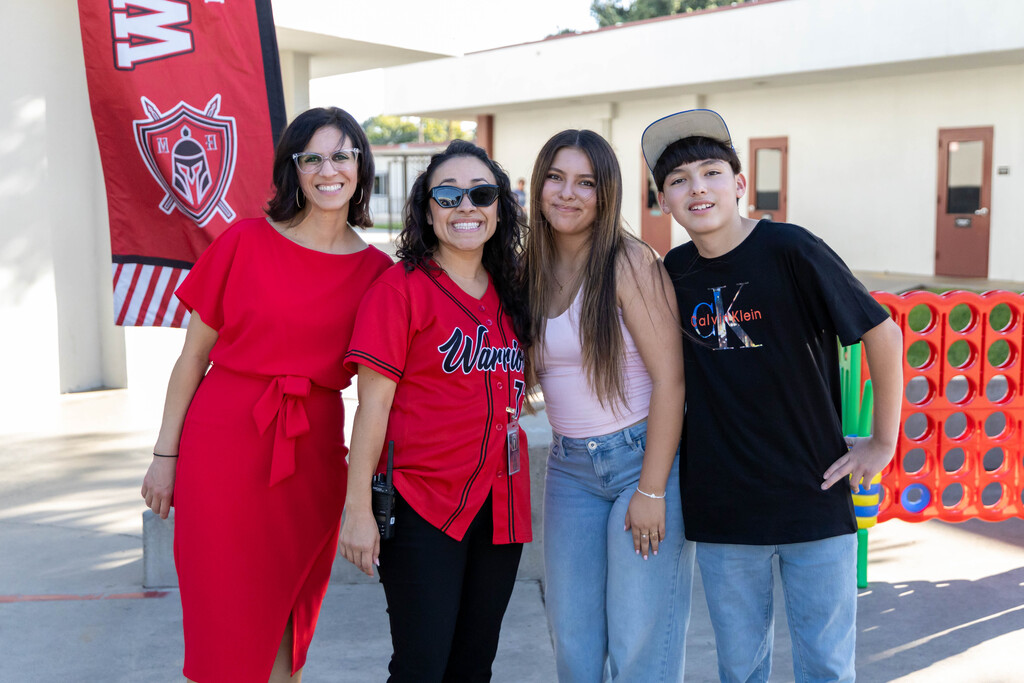 Staff and students smiling for a photo