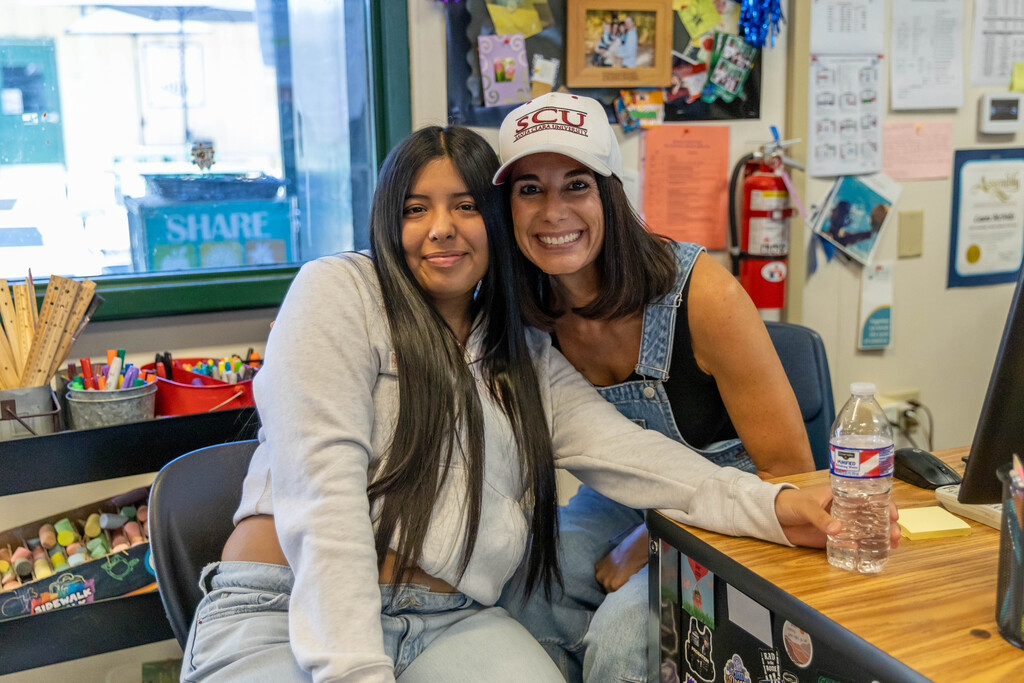 teacher and student smiling
