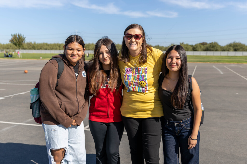 Staff and students smiling for a photo