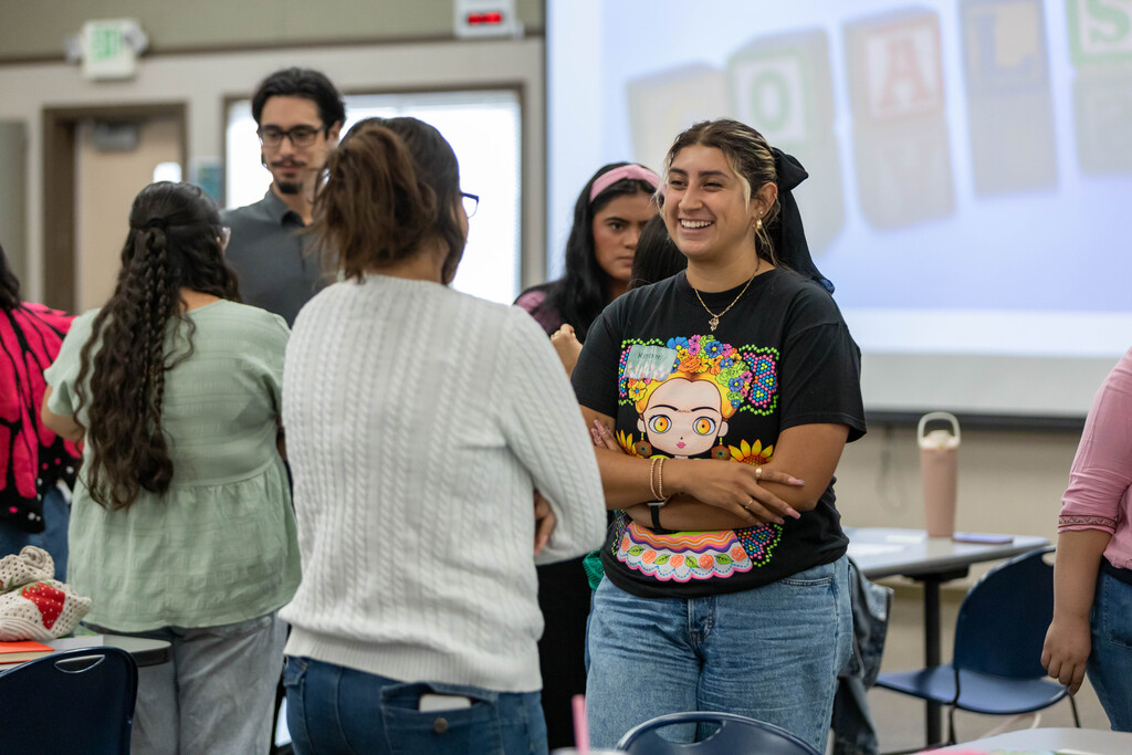 staff talking in small groups