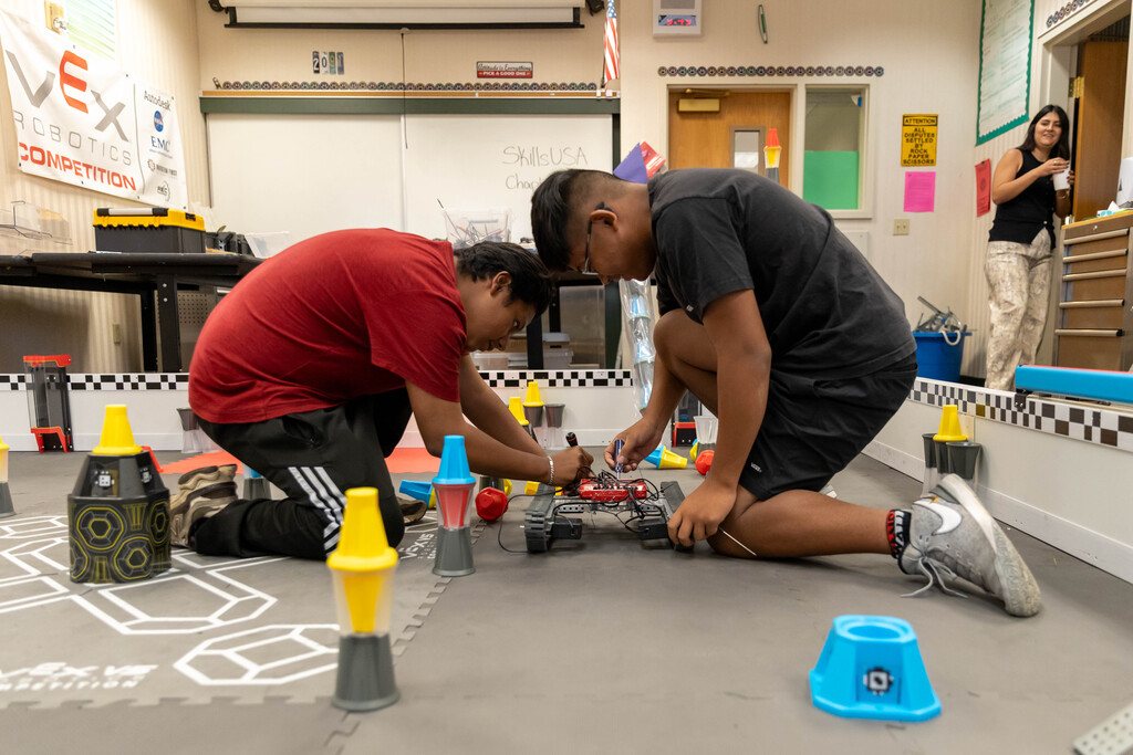 students working on a robot
