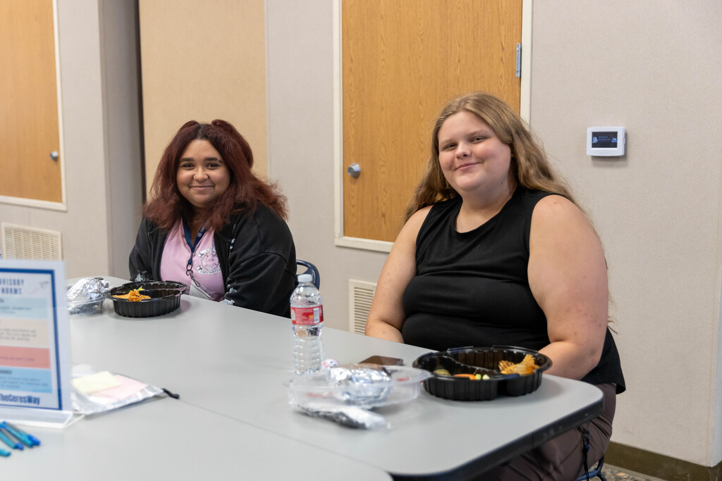two students sitting at a table