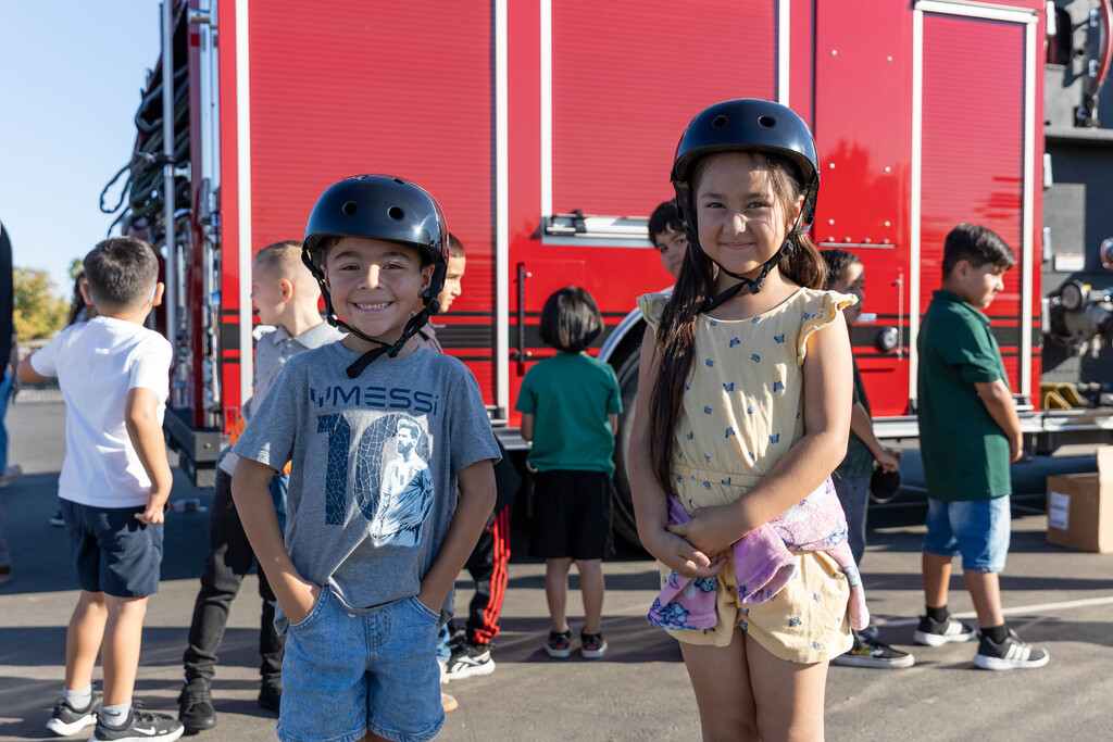 two students in bike helmets 
