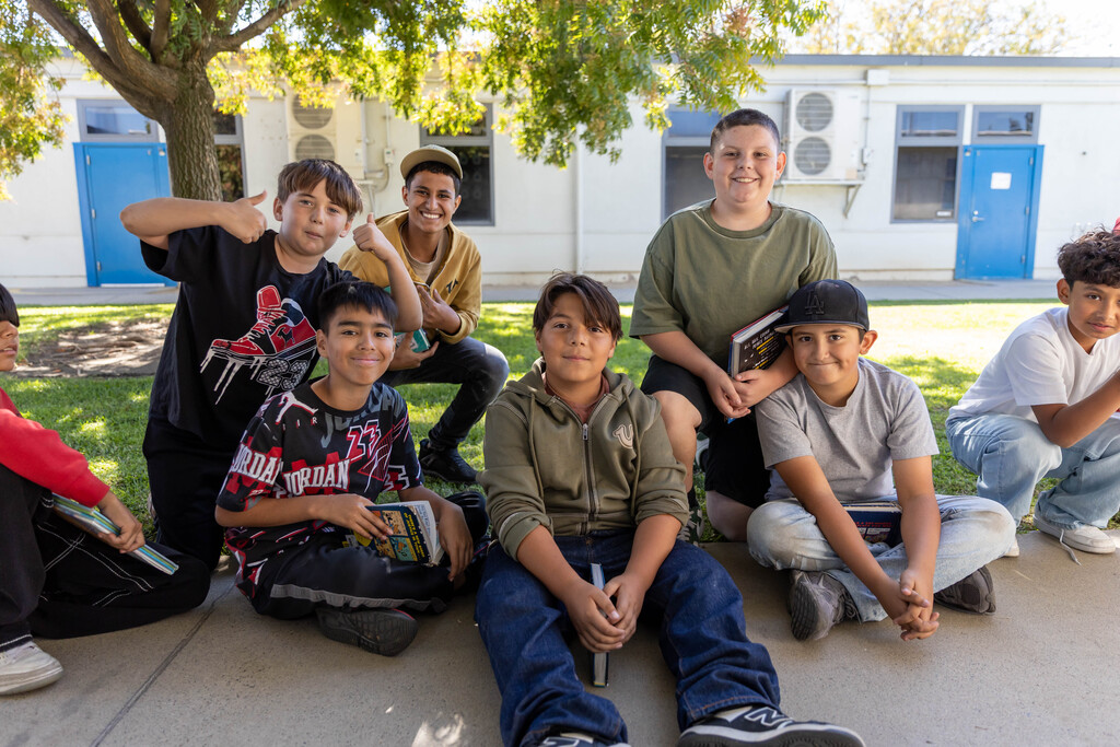 A group of students sitting on the floor