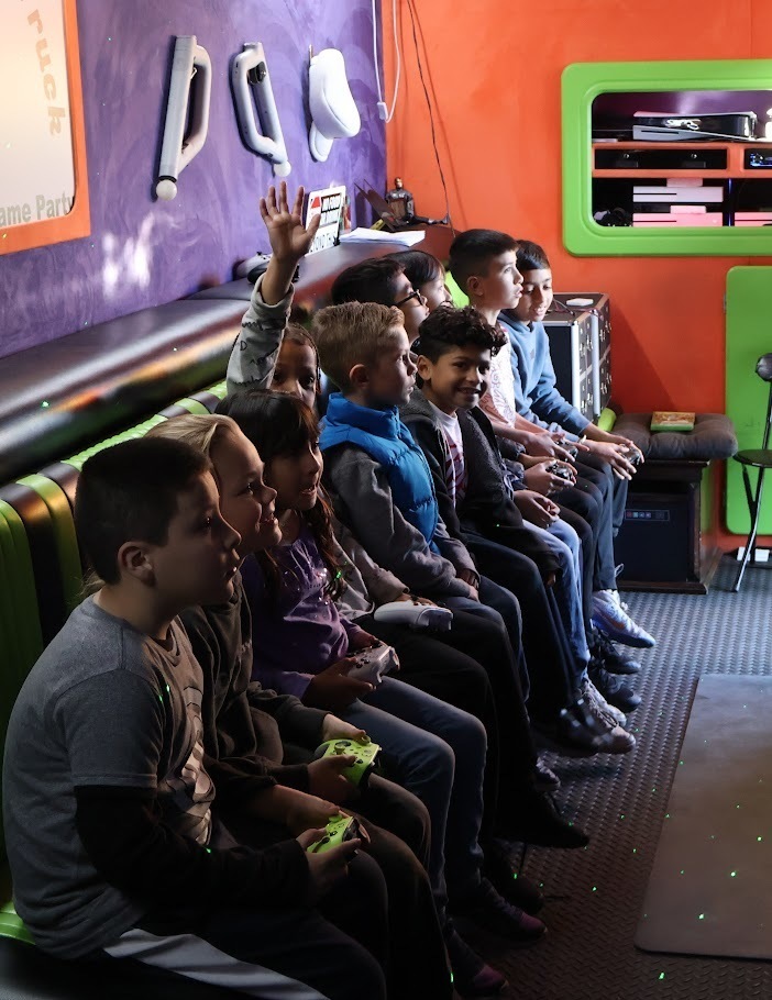 Students play games in gaming truck