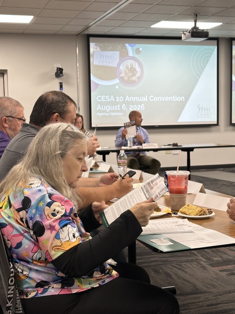 Woman reading CESA 10 annual report