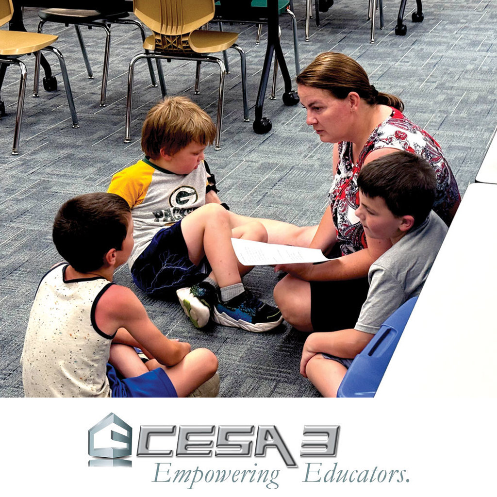 Niki Smith from CESA 3 working with students at Blanchardville Public Library
