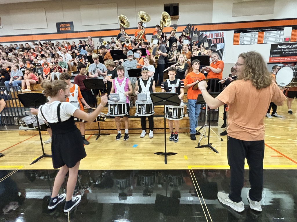 Oconto Falls band plays their school song.