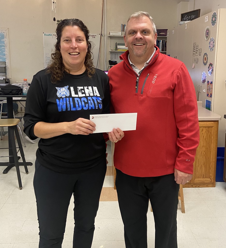 Michele DeBauch posing with a certificate from OJ's for a free pie.