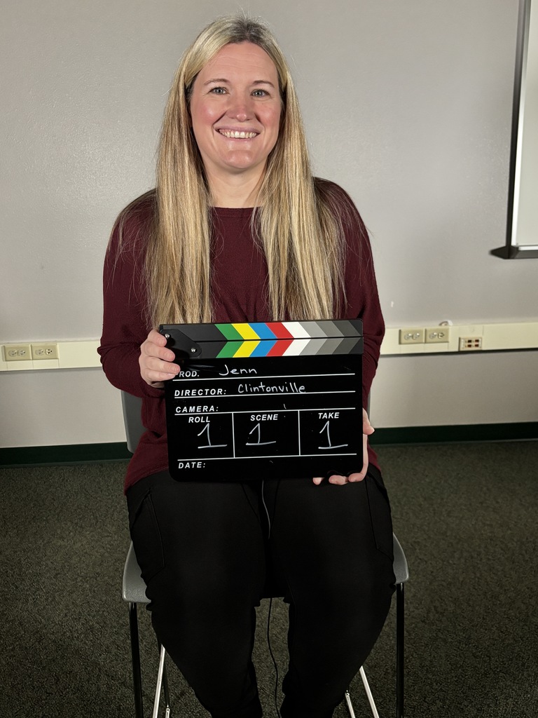 A person holding a clapper board.