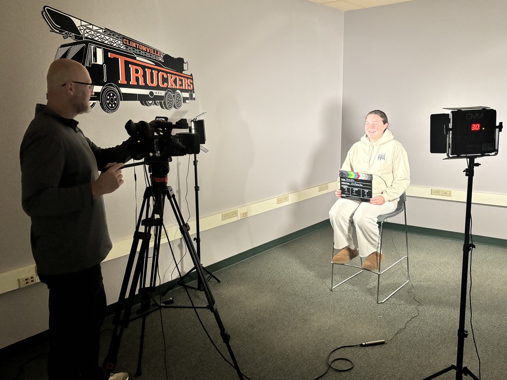 Dean Leisgang filming an interview.
