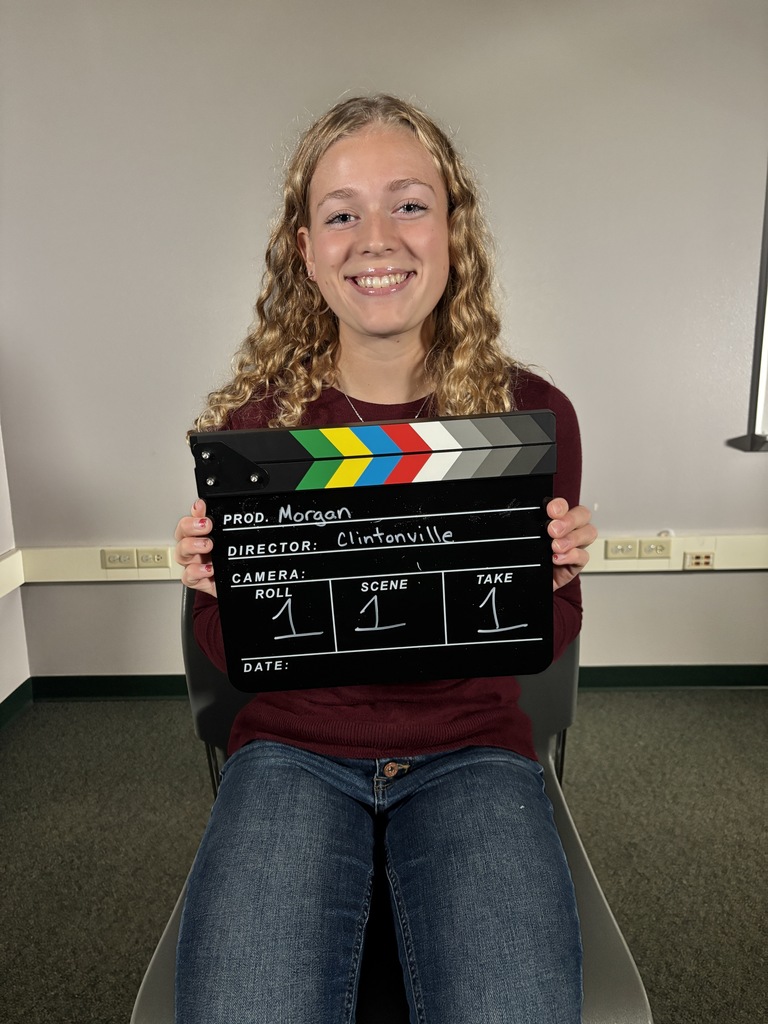 Student holding a clapper board.