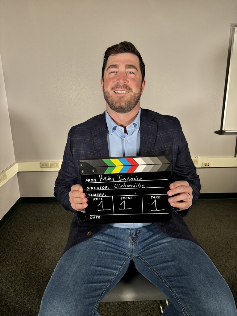 A person holding a clapper board.