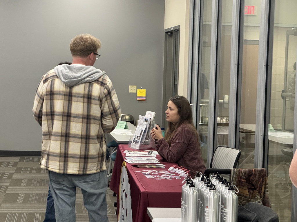 Students and exhibitors talk at a Transition Fair.