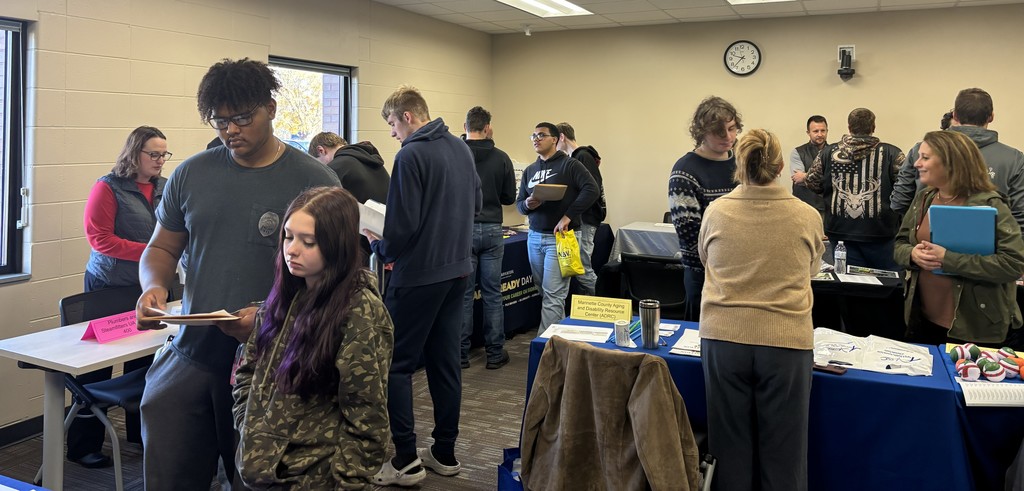 Students and educators talk at a Transition Fair.