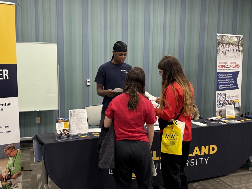 Students and exhibitors talk at a Transition Fair.