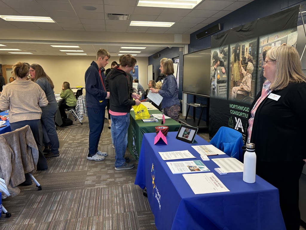 Students and educators talk at a Transition Fair.