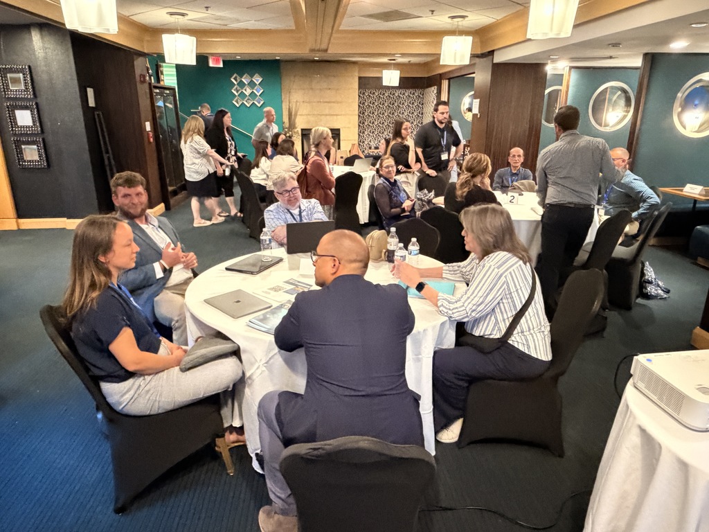 AI Policy Summit groups working.