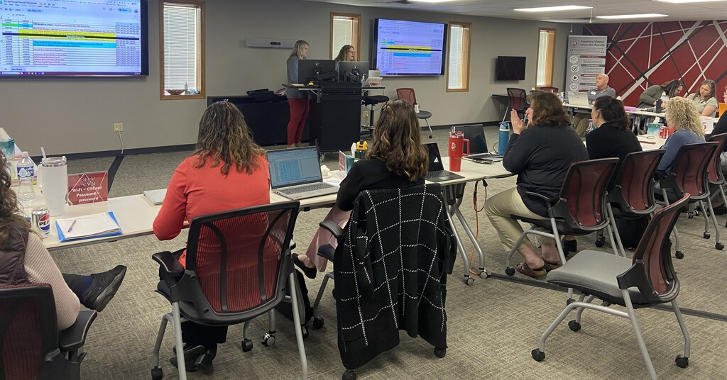 Business Services employees presenting to a small group