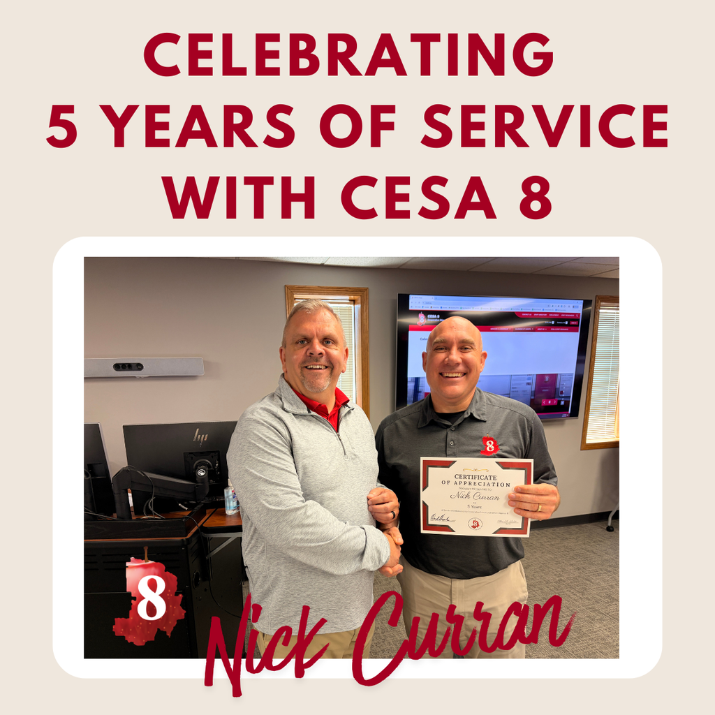 Nick Curran holding up anniversary certificate