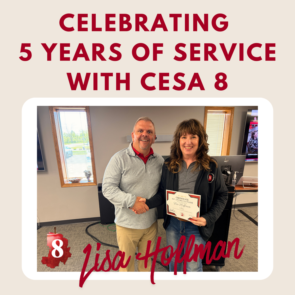 Lisa Hoffman holding up an anniversary certificate