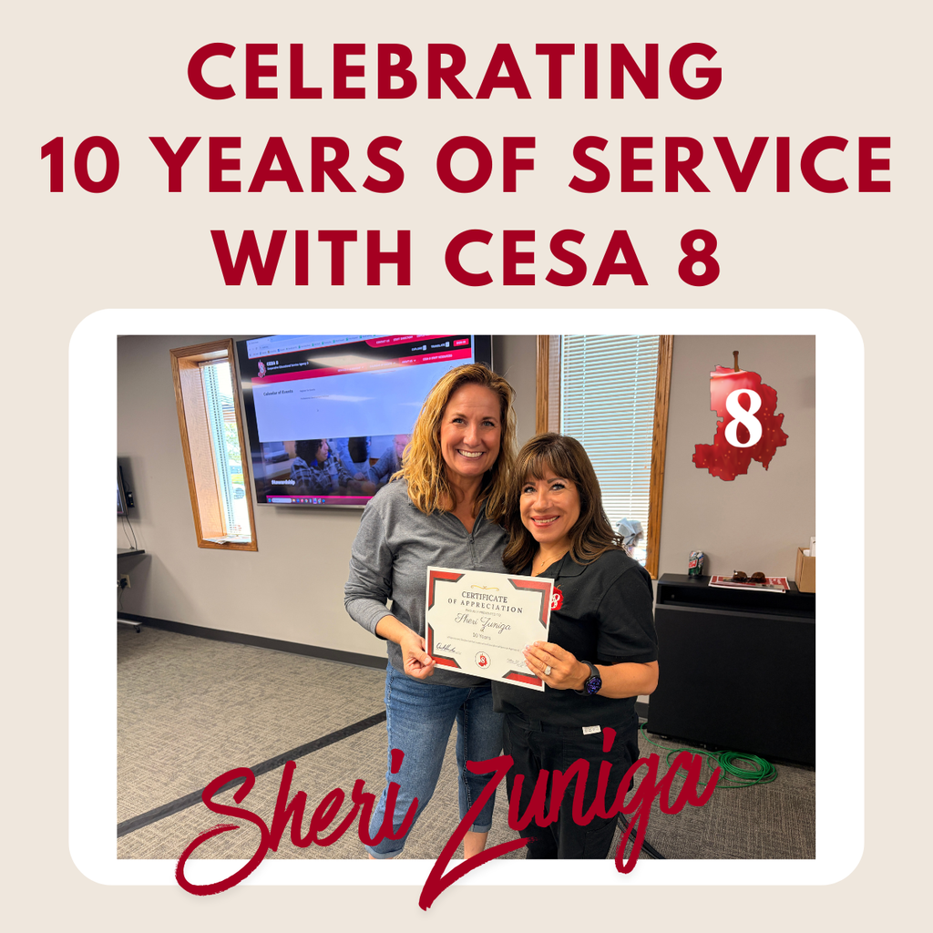 Sheri Zuninga holding up an anniversary certificate