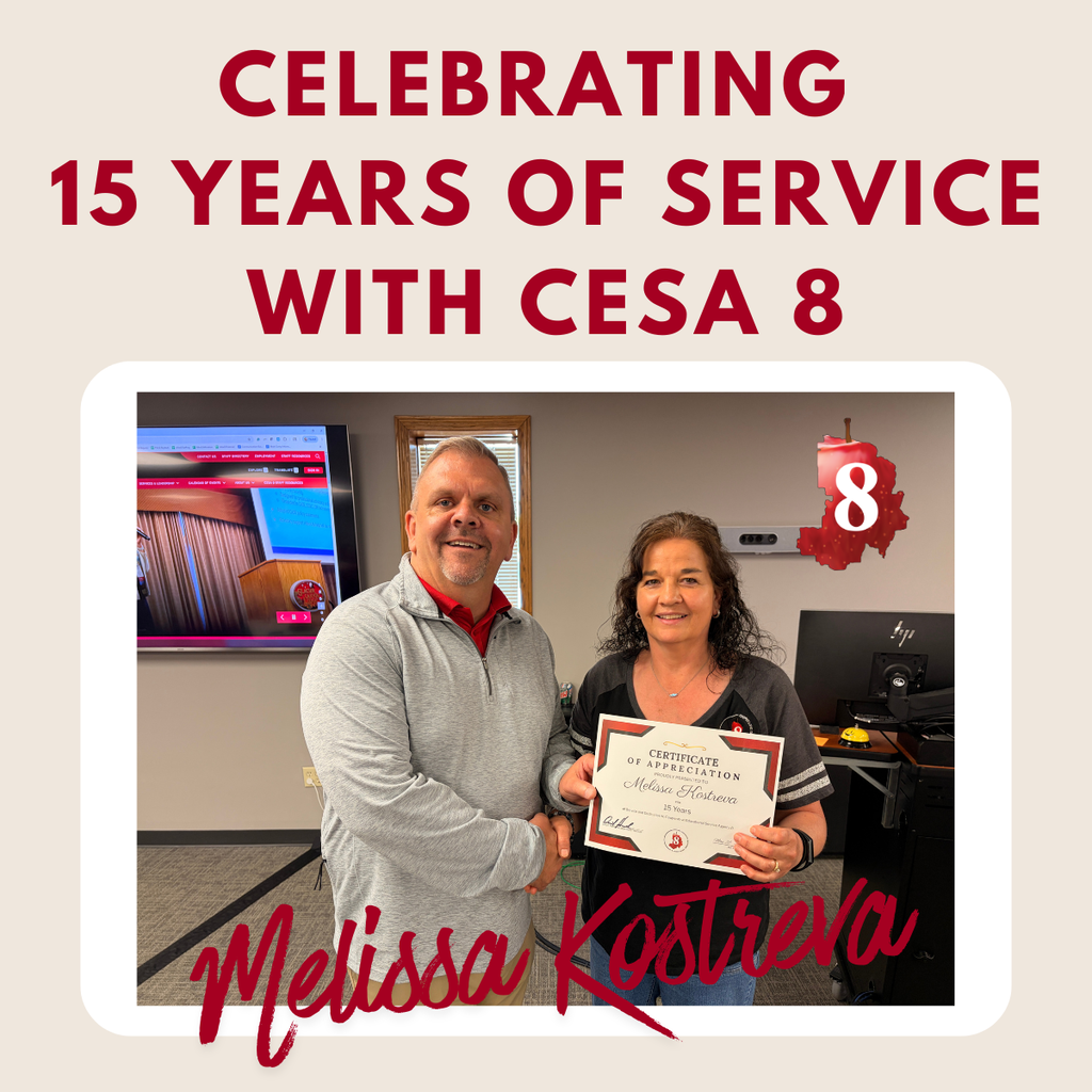 Melissa Kostreva holding up an anniversary certificate
