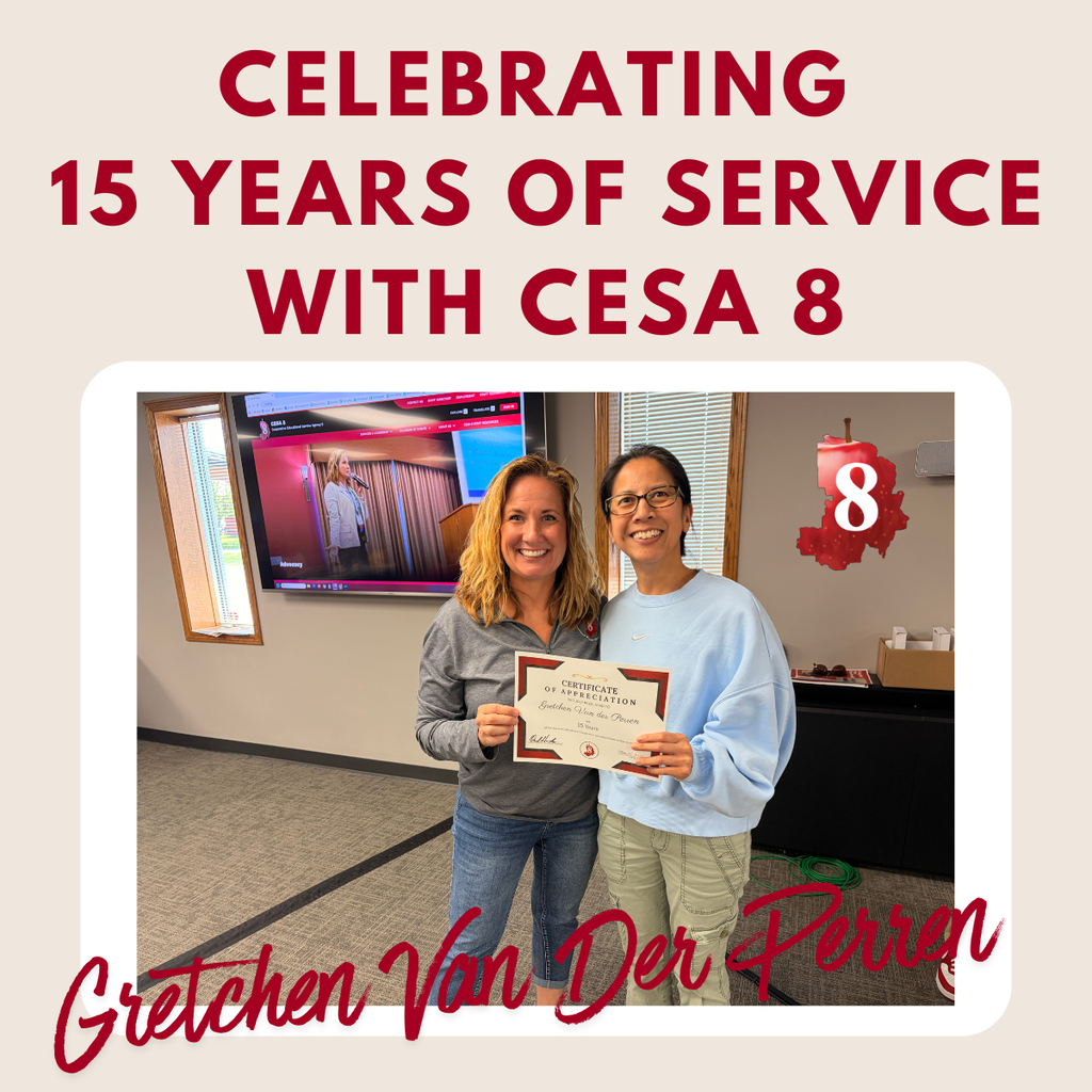 Gretchen Van Der Perren holding up an anniversary certificate