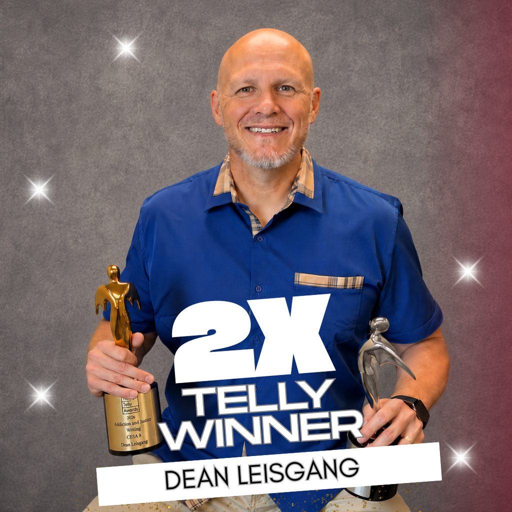 Dean Leisgang holding Telly Awards.