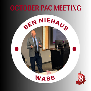 Ben Niehaus speaking at the front of a room.