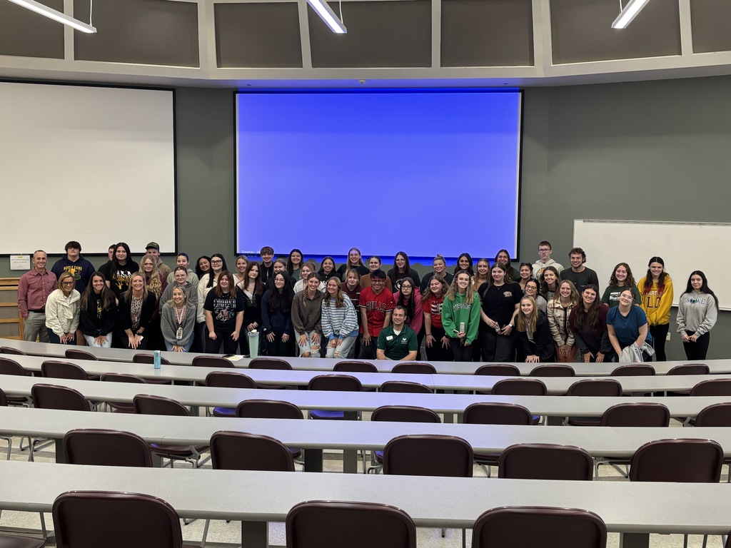 A group of students poses for a picture at education career event.