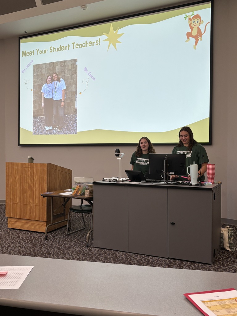 A presenter talks to a group at a recent education career event.
